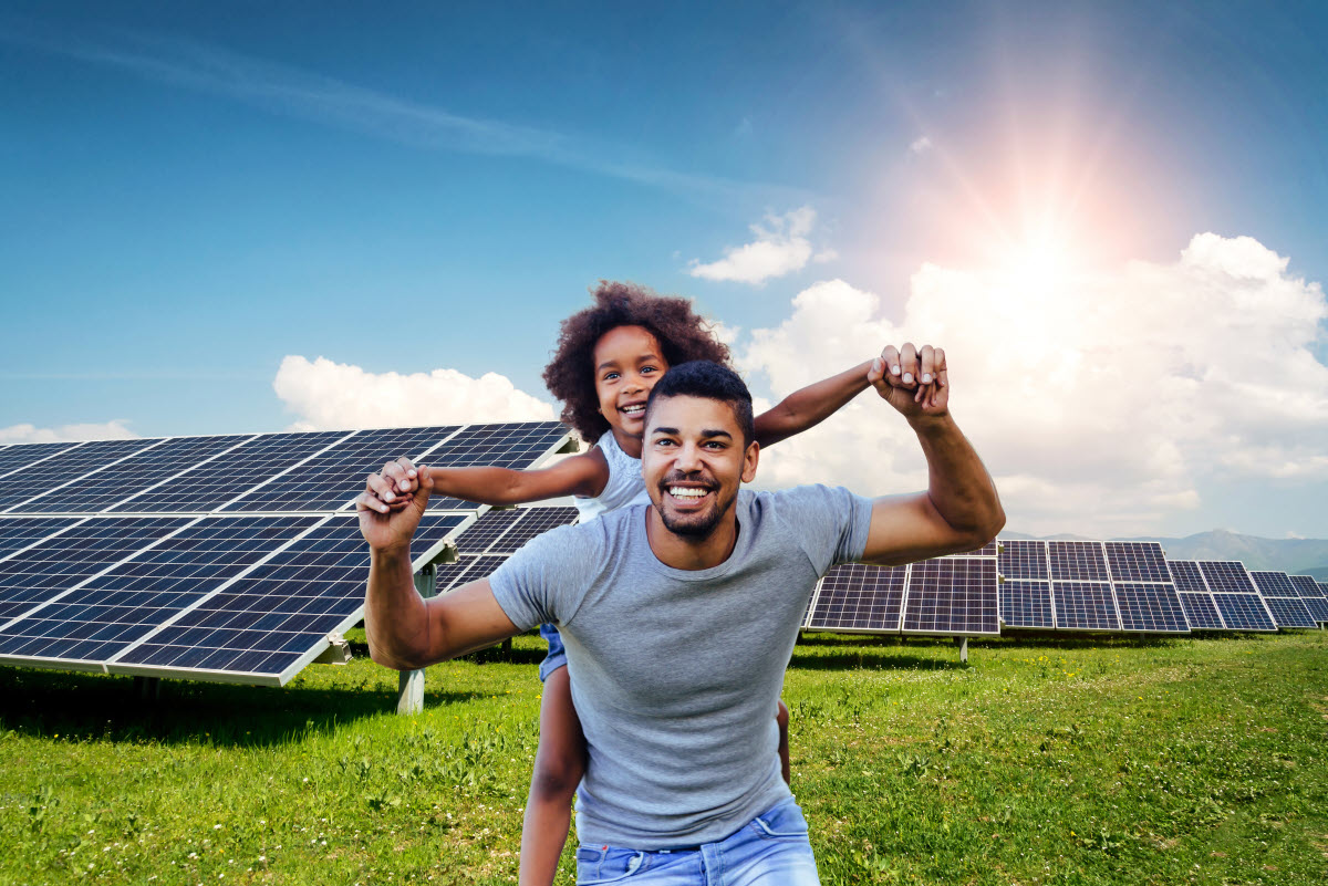 Dad and daughter in a solar field