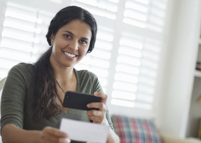 woman paying a bill