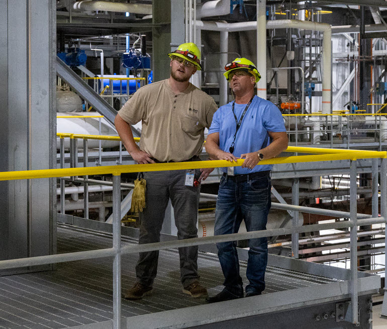 two engineers in a power facility