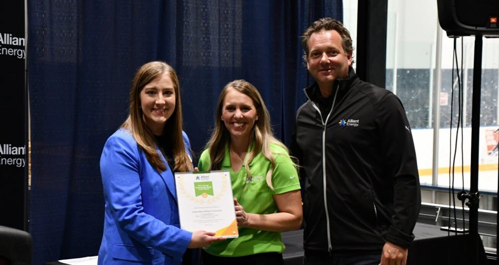 Brittany Scanlon (Cedar Valley Habitat for Humanity) with Emily Kaiser and Ben Lapari (Alliant Energy)