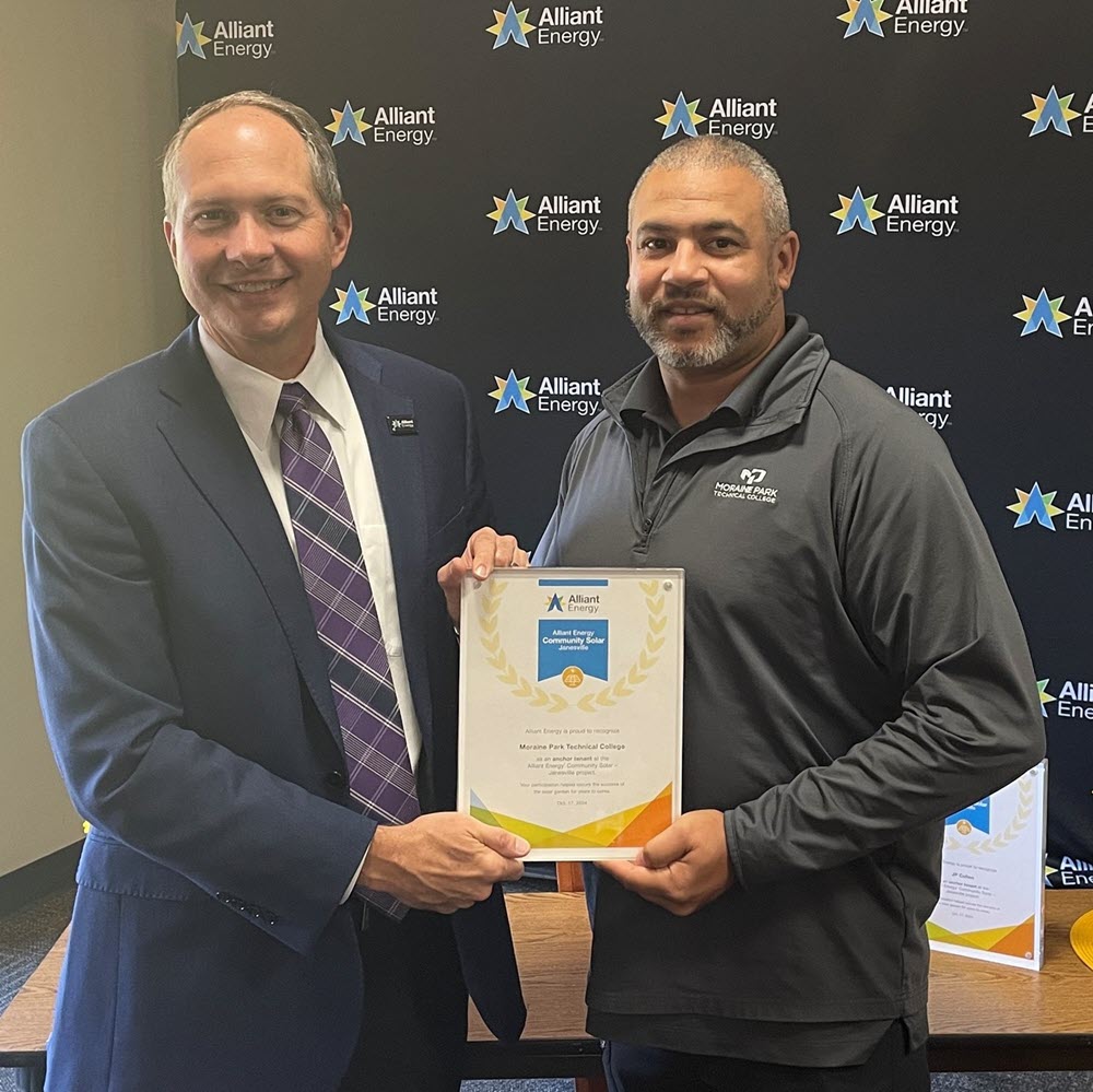 Roy Marquez, director of facilities with Moraine Park Technical College, and JP Brummond, vice president, Alliant Energy 